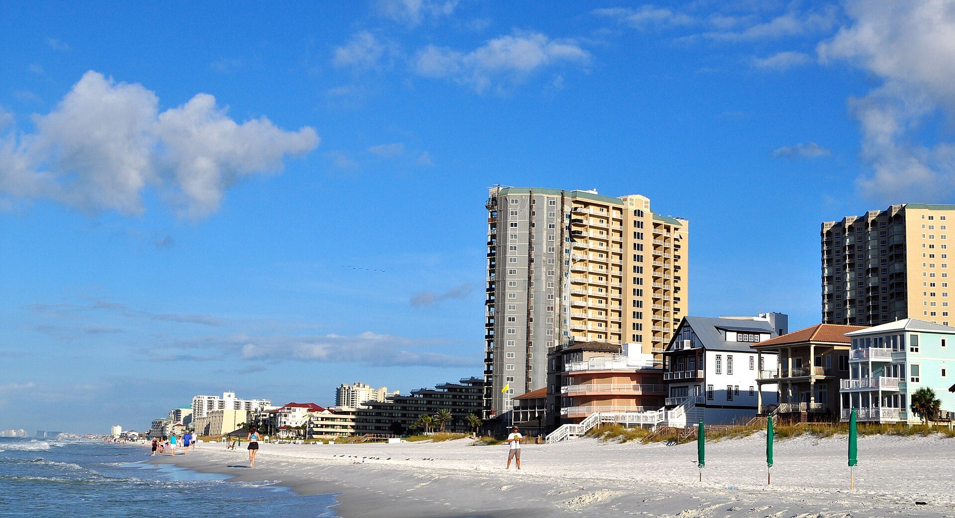 Condominium towers and beach houses along the shore at Miramar Beach