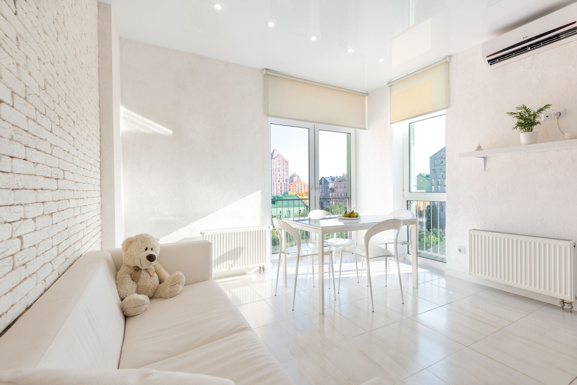 A bright furnished kitchen and dining area in an apartment