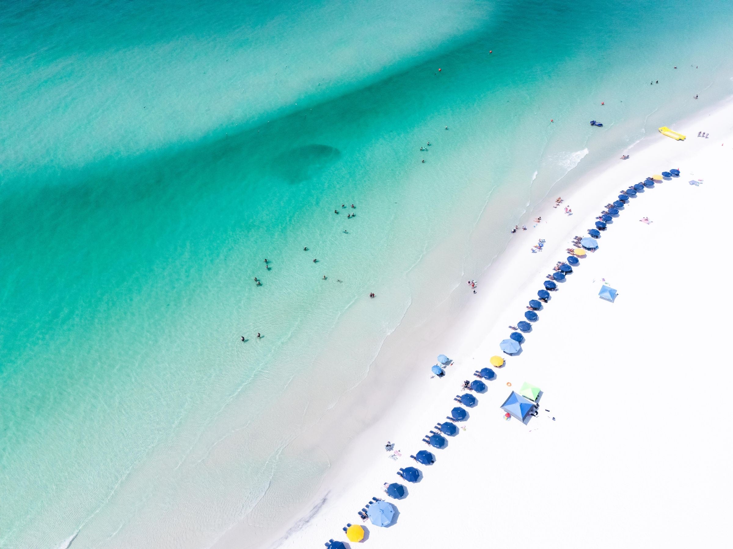 Aerial view of turquoise water and white sand at Santa Rosa Beach