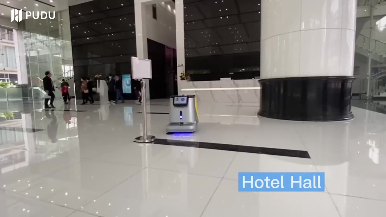 A Pudu CC1 cleaning robot at work in a hotel hall